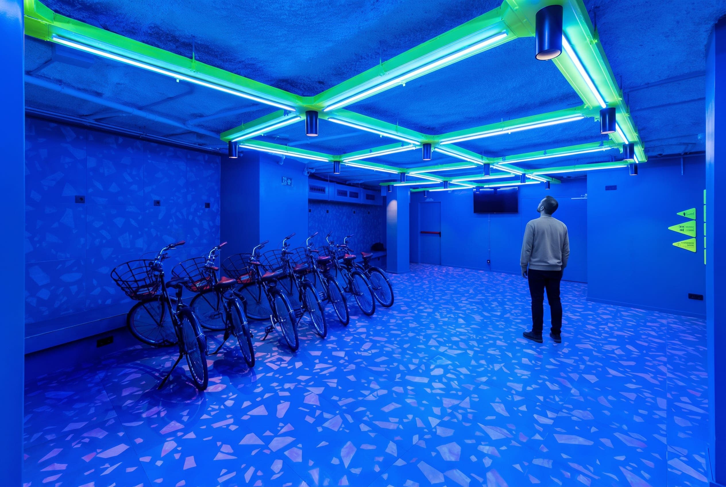 Blue basement room with green light lines on the ceiling