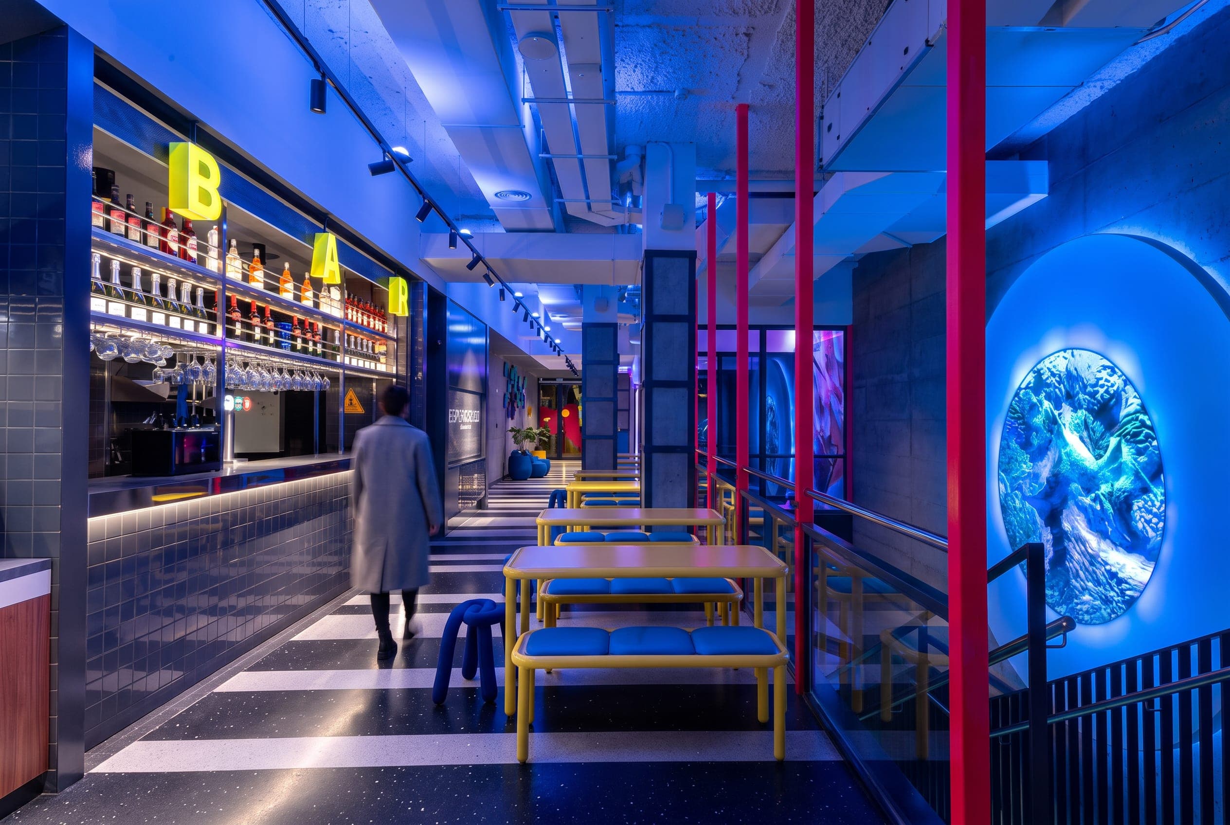 Ground floor with the main circular LED screen and the bar