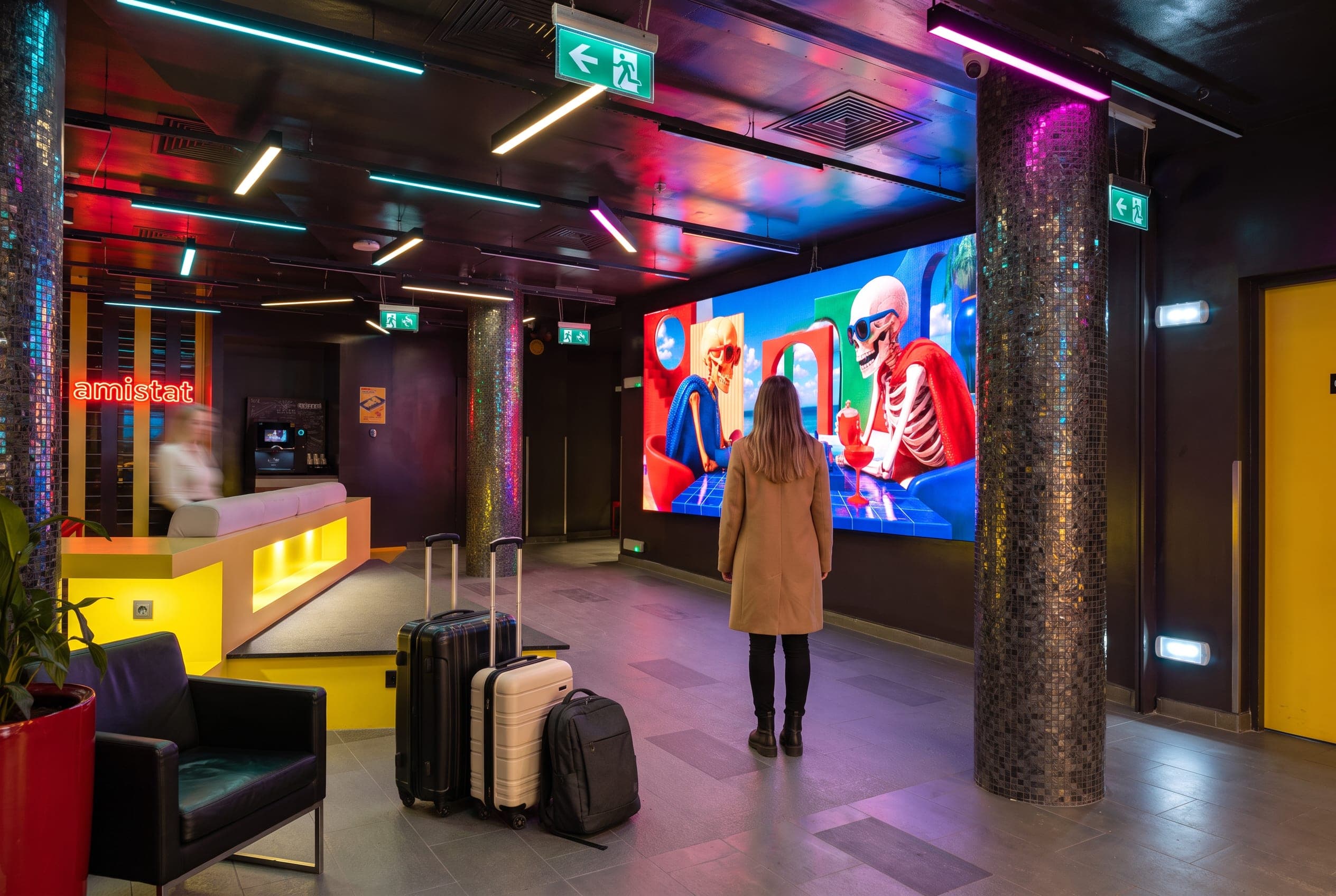 Traveler arriving in front of the LED wall