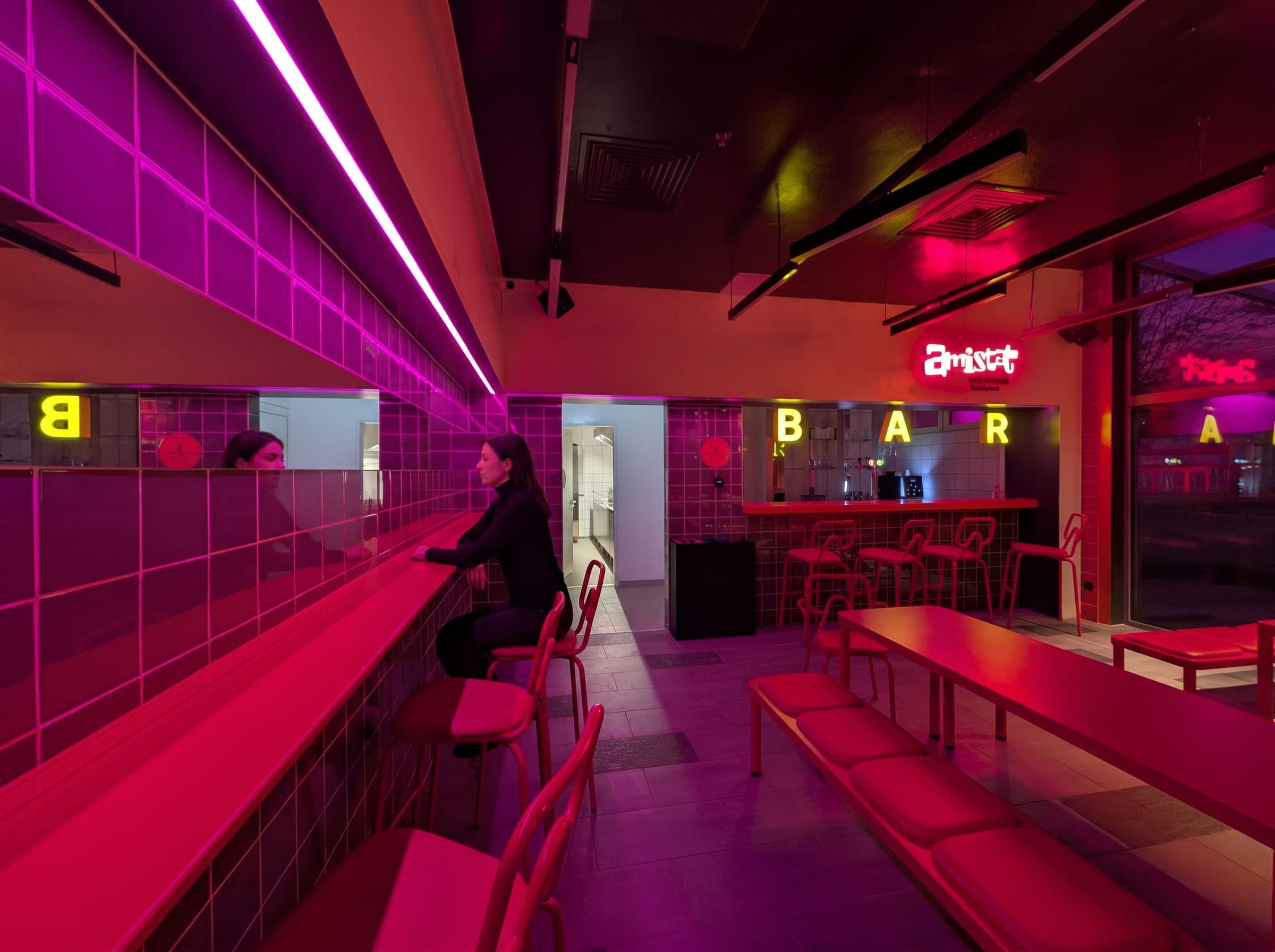 Magenta-lit bar