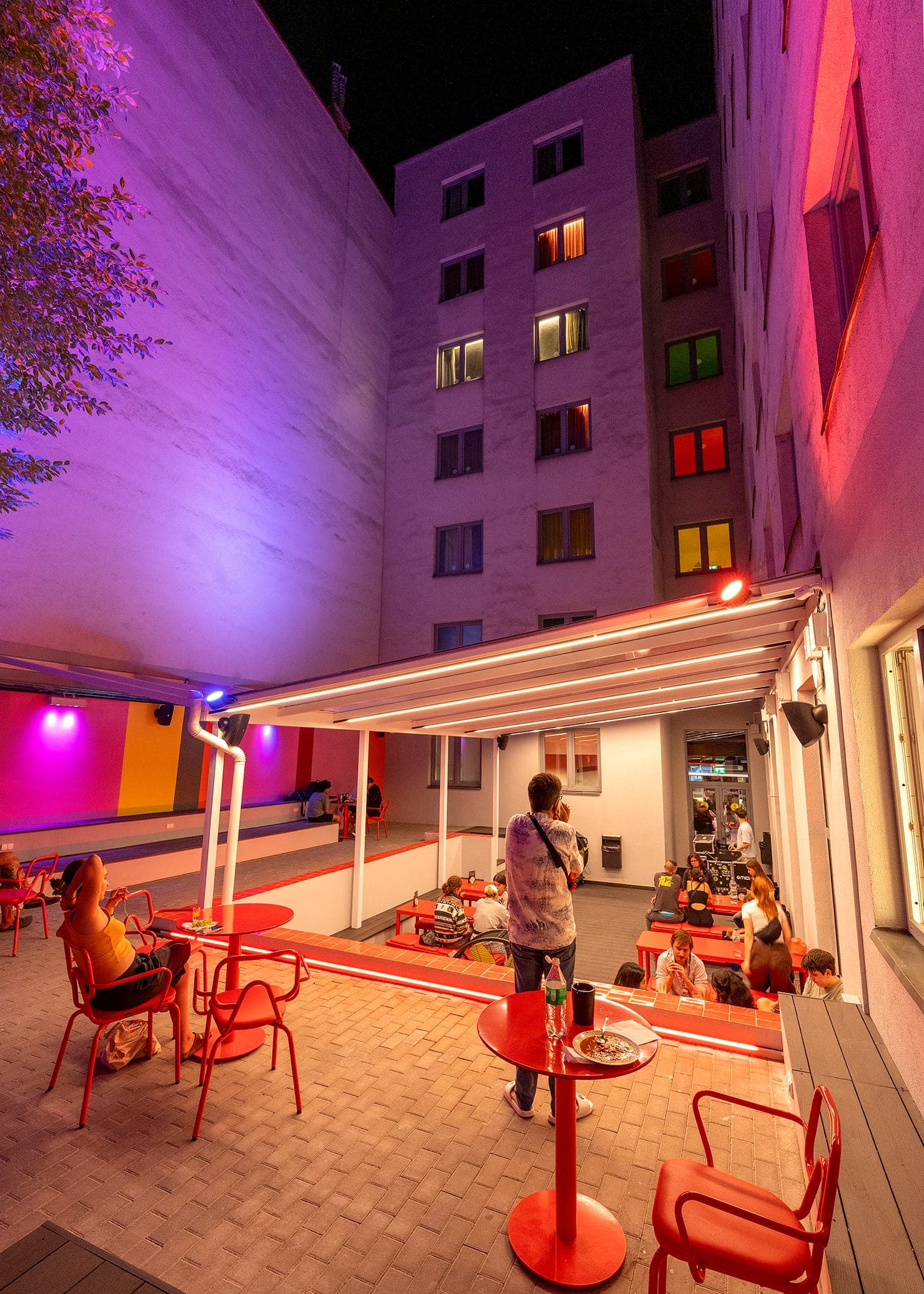 Courtyard terrace under the lit canopy, portrait view